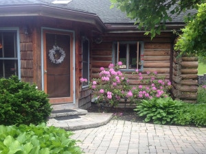 Front door of chalet of canandaigua log cabin
