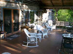 whicker rocking chairs on log cabin porch