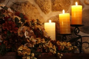 candles on harth with fall decorations